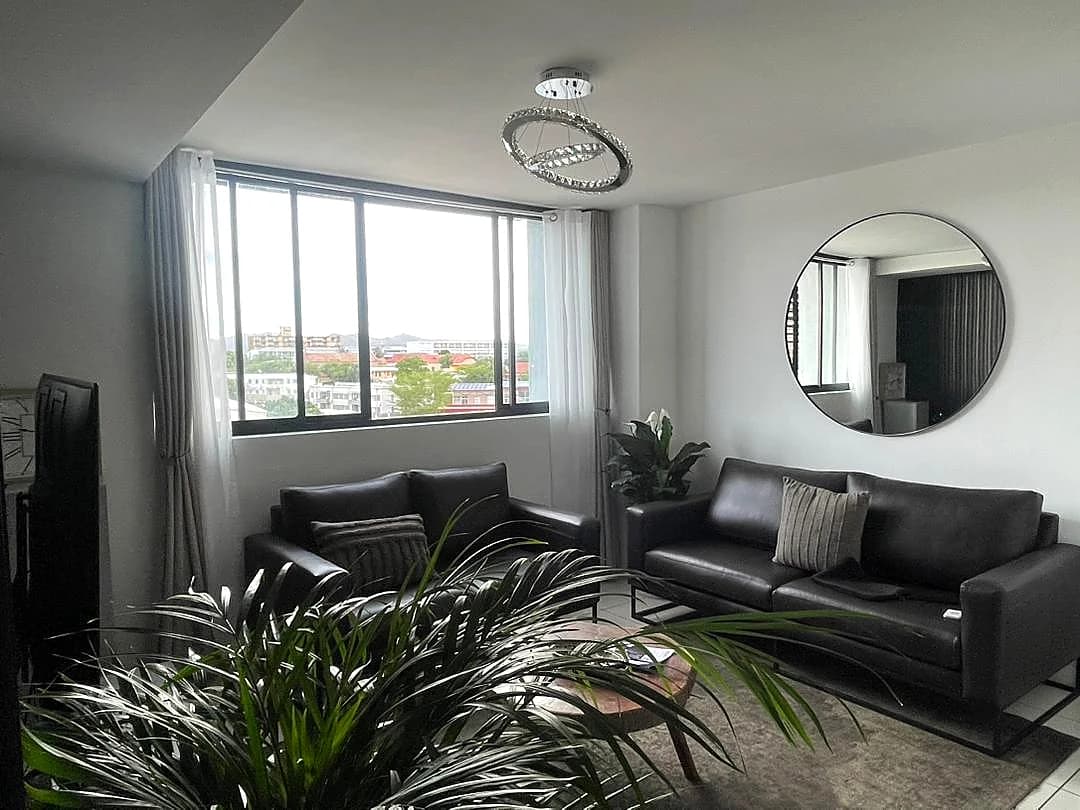 Second living room with comfortable seating and warm tones