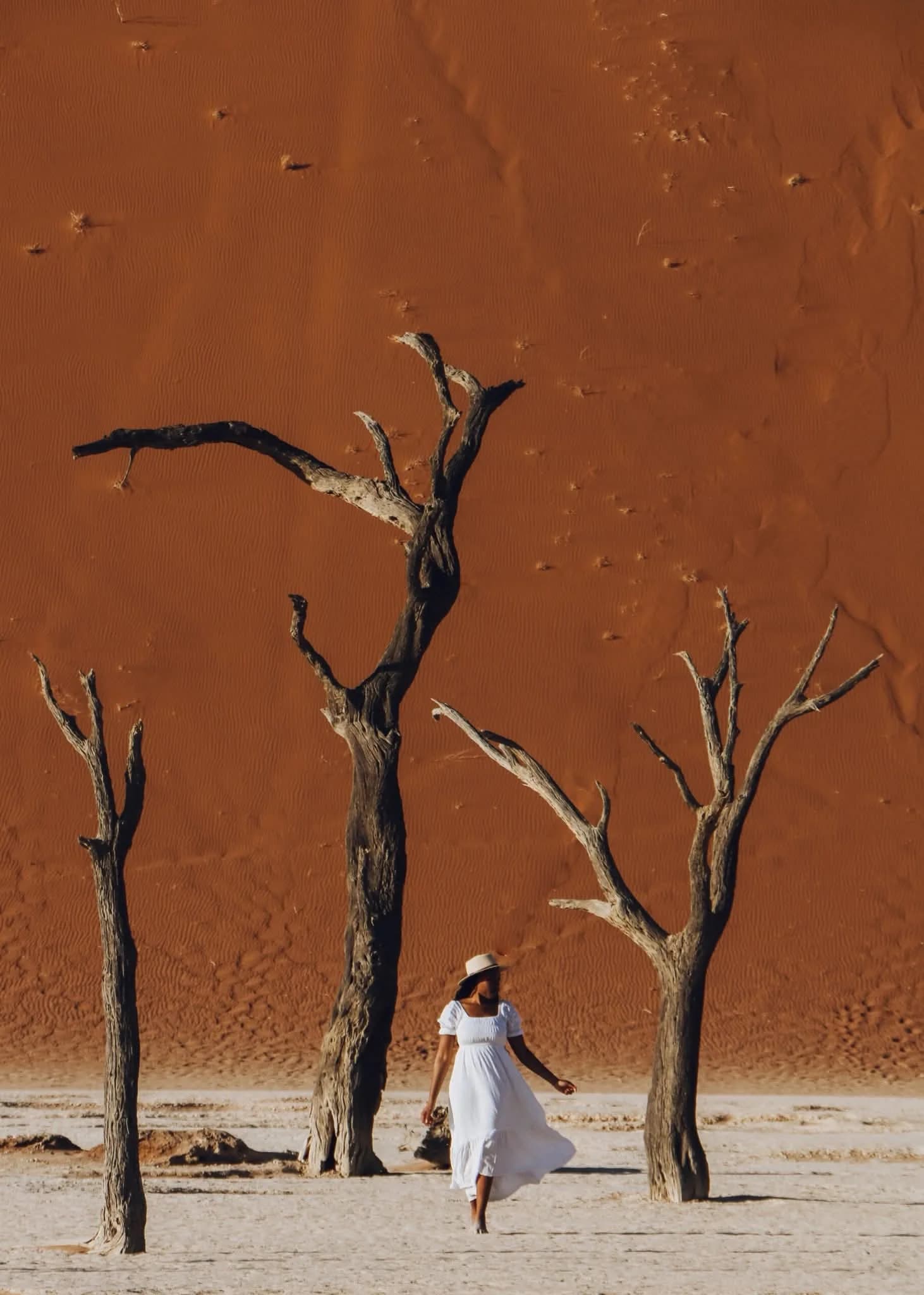 Woman in white dress at Deadvlei