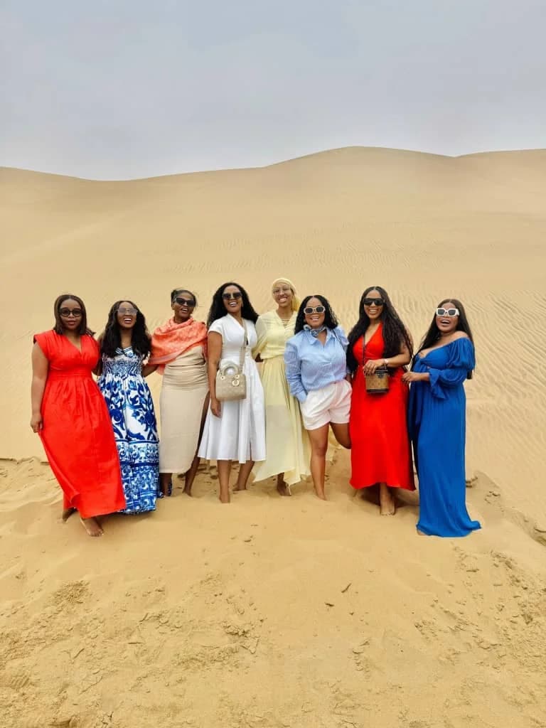 Colourful group of women on the dunes